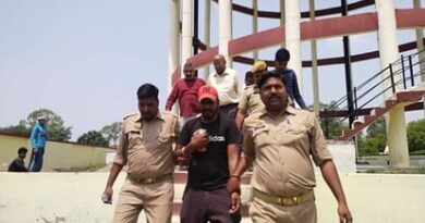 The young man climbed on the water tank